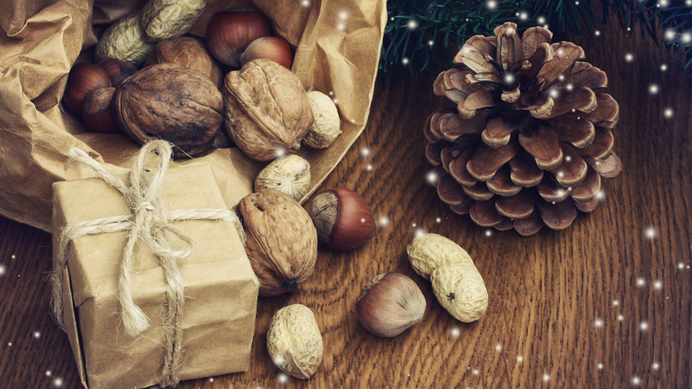 Traditional Christmas presents, pine cone and nuts showing the history of Christmas lesson resources